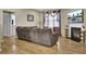 Comfortable living room featuring a fireplace, TV, and hardwood floors at 9676 Godwin St, Ladson, SC 29456