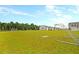 Soccer field provides recreational space for neighborhood residents with green space and homes at 9676 Godwin St, Ladson, SC 29456