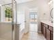 A bright bathroom featuring a shower, tub, double sinks and vanity, with an open doorway to the bedroom at 1007 Halfacre Ln, Ladson, SC 29456