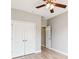 This bedroom features light, airy walls, a ceiling fan, a closet, and an open doorway at 1007 Halfacre Ln, Ladson, SC 29456