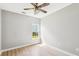 This bedroom features light, airy walls and a window with a view at 1007 Halfacre Ln, Ladson, SC 29456