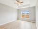This bedroom features light, airy walls, a ceiling fan, and a window with a view at 1007 Halfacre Ln, Ladson, SC 29456