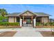 Community clubhouse with covered entryway, landscaping, and accessible parking at 1007 Halfacre Ln, Ladson, SC 29456