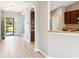 Neutral walls and wood flooring complement the open floor plan and the adjacent kitchen at 1007 Halfacre Ln, Ladson, SC 29456
