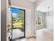 Inviting entryway showcasing an open floor plan with hardwood floors leading to a dining area with natural light at 1007 Halfacre Ln, Ladson, SC 29456