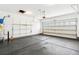 Spacious two car garage with shelving and freshly painted walls with high ceilings at 1007 Halfacre Ln, Ladson, SC 29456