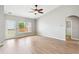 Spacious living room with windows and a glass-paned door to the backyard at 1007 Halfacre Ln, Ladson, SC 29456