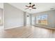 Light-filled living room with a ceiling fan and views of the backyard at 1007 Halfacre Ln, Ladson, SC 29456