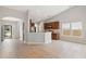 Open floor plan with neutral walls, hardwood floors, and stainless appliances in the modern kitchen at 1007 Halfacre Ln, Ladson, SC 29456