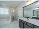Bright bathroom featuring a soaking tub, glass-enclosed shower, and a modern vanity with a large mirror at 101 Firebrick Way, Summerville, SC 29483