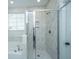 Elegant bathroom with marble tile, glass shower, and soaking tub for a spa-like experience at 101 Firebrick Way, Summerville, SC 29483