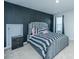 Modern bedroom featuring a striking black accent wall and a stylish striped bed set at 101 Firebrick Way, Summerville, SC 29483