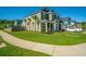 Attractive two-story home with a lush green lawn, palm trees, and curb appeal at 101 Firebrick Way, Summerville, SC 29483
