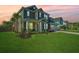 Inviting two-story home with a lush green lawn, well-manicured landscaping, and a welcoming front porch at 101 Firebrick Way, Summerville, SC 29483
