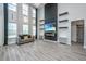 Open-concept living space featuring a sleek fireplace, high ceilings, and seamlessly connected to the modern kitchen at 101 Firebrick Way, Summerville, SC 29483
