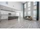 Bright living room with soaring ceilings, large windows, and an open floor plan to the modern kitchen at 101 Firebrick Way, Summerville, SC 29483