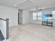 Upstairs loft space features carpeted floors, a ceiling fan, and a media center creating a versatile living area at 101 Firebrick Way, Summerville, SC 29483