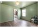 Bedroom with hardwood floors, closet, a window, and green painted walls at 1052 Sago Palm Ct, Mount Pleasant, SC 29429