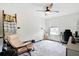 Bedroom with modern ceiling fan, stylish rug, lots of natural light, and a functional work-from-home area at 1052 Sago Palm Ct, Mount Pleasant, SC 29429