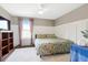 Bedroom with bed, ceiling fan, curtains, and white wainscotting at 1052 Sago Palm Ct, Mount Pleasant, SC 29429