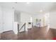 Spacious loft area with hardwood floors, natural light, and versatile space for entertaining or relaxing at 1052 Sago Palm Ct, Mount Pleasant, SC 29429