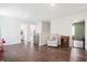 Bright, open loft area with hardwood floors, a cozy chair, and multiple doorways, perfect for flexible living at 1052 Sago Palm Ct, Mount Pleasant, SC 29429