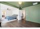 Expansive main bedroom with hardwood floors, an en-suite bathroom, and a connected playroom at 1052 Sago Palm Ct, Mount Pleasant, SC 29429