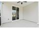 Covered porch with ceiling fan and sliding glass doors to the interior at 1052 Sago Palm Ct, Mount Pleasant, SC 29429