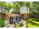 Backyard featuring a modern hot tub, tree house and manicured artificial grass at 1070 Blue Marlin Dr, Charleston, SC 29412