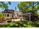 Landscaped backyard with screened porch, outdoor grill and sports area at 1070 Blue Marlin Dr, Charleston, SC 29412