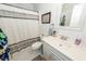 Bright bathroom with white cabinetry, patterned shower curtain, and classic design at 1070 Blue Marlin Dr, Charleston, SC 29412