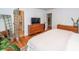 Bright bedroom featuring hardwood floors and a doorway to the closet and ensuite bath at 1070 Blue Marlin Dr, Charleston, SC 29412