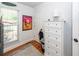 Bright bedroom with hardwood floors, a dresser, and a large window offering plenty of natural light at 1070 Blue Marlin Dr, Charleston, SC 29412