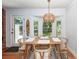 Bright dining area featuring bay windows, a wooden table set, and stylish decor at 1070 Blue Marlin Dr, Charleston, SC 29412