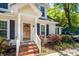 Charming home featuring a wooden front door with glass accents and a well-manicured front garden at 1070 Blue Marlin Dr, Charleston, SC 29412