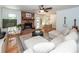 Cozy living room featuring a brick fireplace, hardwood floors, and a large sectional sofa at 1070 Blue Marlin Dr, Charleston, SC 29412