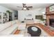 Inviting living room with a brick fireplace, hardwood floors, and a large sectional sofa at 1070 Blue Marlin Dr, Charleston, SC 29412
