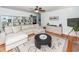 Comfortable living room with a large sectional sofa, built-in shelving, and hardwood flooring at 1070 Blue Marlin Dr, Charleston, SC 29412
