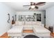 Bright living room showcasing a large sectional sofa, hardwood floors, and built-in shelving at 1070 Blue Marlin Dr, Charleston, SC 29412