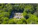 Aerial view of boat storage lot showing RVs and boats surrounded by lush trees at 112 Huckleberry Ln, Summerville, SC 29485