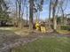 A backyard featuring a yellow playset complete with a slide, perfect for Gathering fun at 112 Huckleberry Ln, Summerville, SC 29485