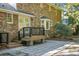 Charming brick home exterior with a patio, steps to the deck, and a bay window, perfect for outdoor enjoyment at 112 Huckleberry Ln, Summerville, SC 29485