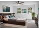 Beautiful bedroom with hardwood floors, windows with green backyard view, and a decorative plant at 112 Huckleberry Ln, Summerville, SC 29485