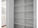 Organized closet with white shelves, with a bathroom in the background at 112 Huckleberry Ln, Summerville, SC 29485