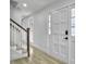 Bright and airy entryway with hardwood floors, white walls, and a staircase at 112 Huckleberry Ln, Summerville, SC 29485
