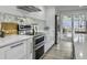 Modern kitchen features stainless steel appliances, mosaic tile backsplash and light countertops at 112 Huckleberry Ln, Summerville, SC 29485