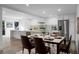 Open concept kitchen and dining area, stainless steel appliances, and neutral color palette at 112 Huckleberry Ln, Summerville, SC 29485