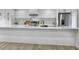 Modern kitchen features stainless steel appliances, mosaic tile backsplash and large center island at 112 Huckleberry Ln, Summerville, SC 29485