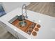 Overhead view of kitchen sink, with built-in cutting board, multi-functional features, and modern faucet at 112 Huckleberry Ln, Summerville, SC 29485