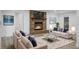 Inviting living room featuring a brick fireplace, cozy seating, and stylish decor at 112 Huckleberry Ln, Summerville, SC 29485